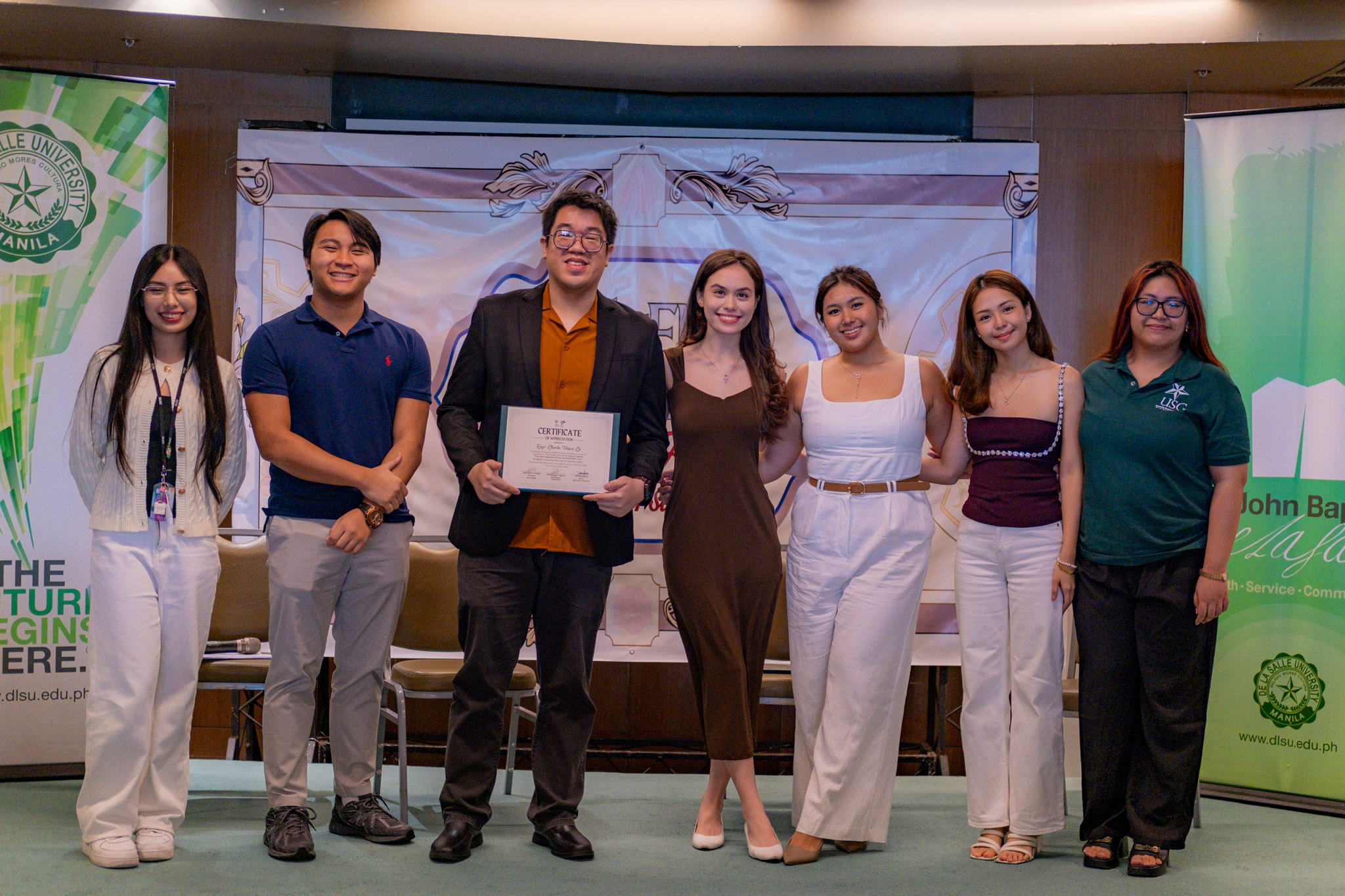 Charles Lu receiving DLSU Certificate of Appreciation on stage with student council leadership at BridgENG Connections