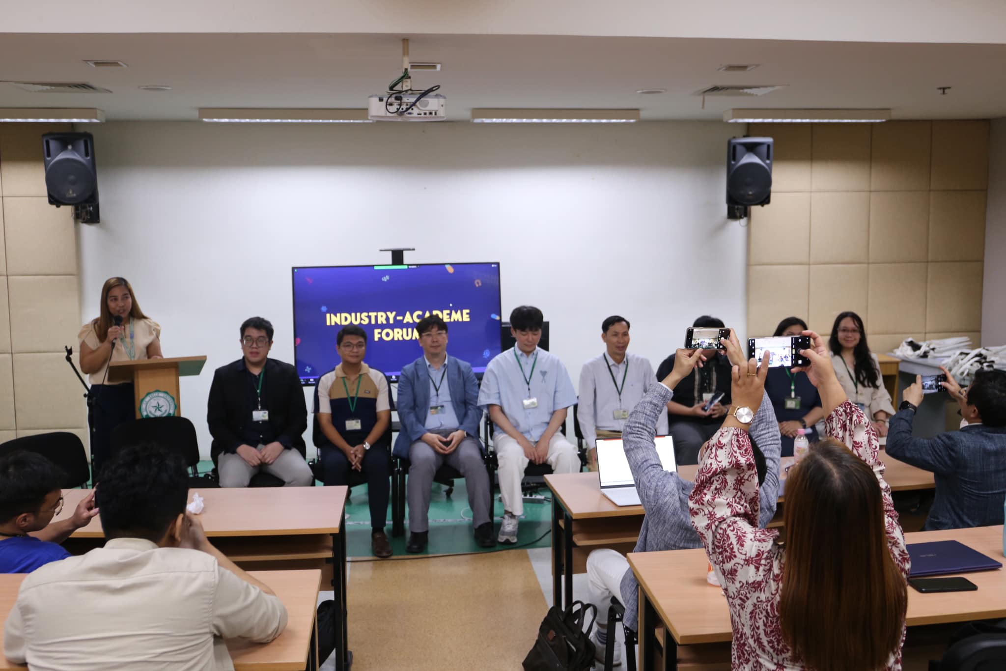 Charles Lu seated on panel during the Industry-Academe Forum at the DLSU Glimpse Symposium with Dr. Bryan Magoling and Inje University researchers